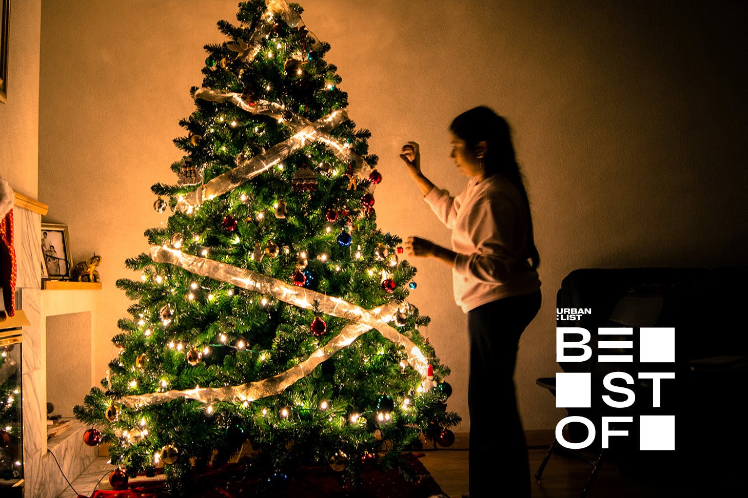 Someone decorates a lovely looking Christmas Tree